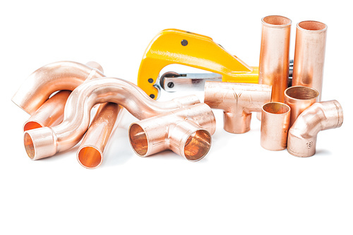 plumbing tools copper pipes fittings and pipe cutter isolated