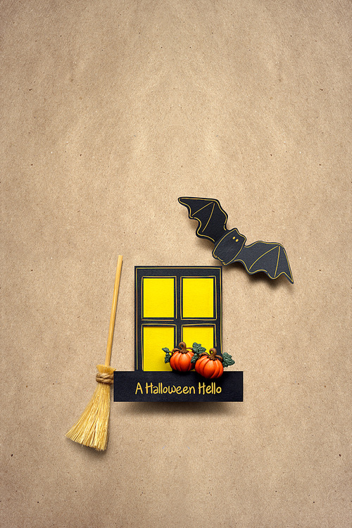 Creative halloween concept photo of window and bats made of paper on brown background.