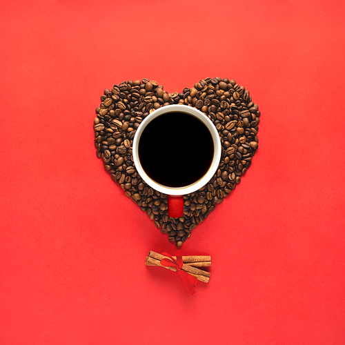 Creative concept still life valentine day holiday photo of espresso coffee cup mug drink beverage with heart made of beans seeds and cinnamon on red background.