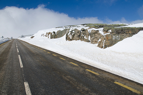 Mountain road with white snow.