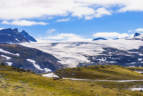 Mountain landscape in summertime with snowy peaks and glaciers. National tourist scenic route 55 Sognefjellet between Lom and Gaupne, Norway.
