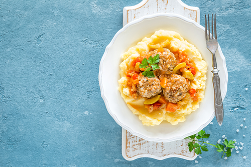 Meatballs in vegetable sauce with mashed potato, top view