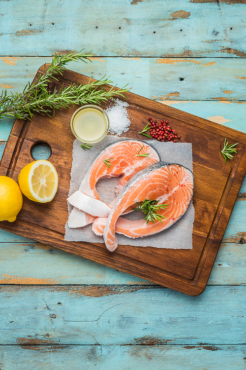 fresh fish. salmon. raw salmon steak with 씨솔트 pepper and herbs. food background.