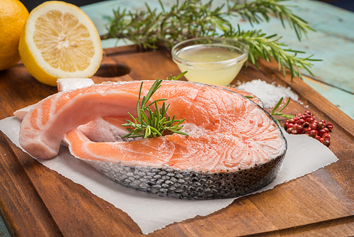 fresh fish. salmon. raw salmon steak with 씨솔트 pepper and herbs. food background.