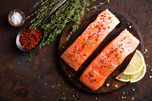 Fresh salmon fish fillet on wooden board