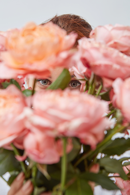 Close-up of a girl holding bright pink roses. Happy Valentine's Day