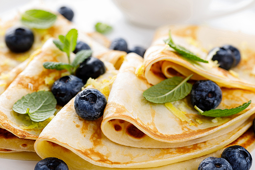 sweet crepes wrapped with fresh berries, crepes with blueberry