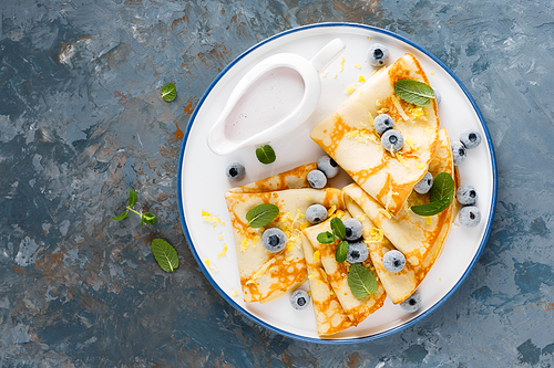 sweet crepes wrapped with fresh berries, crepes with blueberry, top view