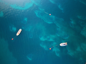 Boats. Aerial view of boats in sea. Beautiful summer seascape with ships, clear azure water at sunny day. Top view.