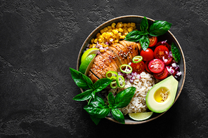 Grilled chicken breast lunch bowl with fresh tomato, avocado, corn, red onion, rice and basil