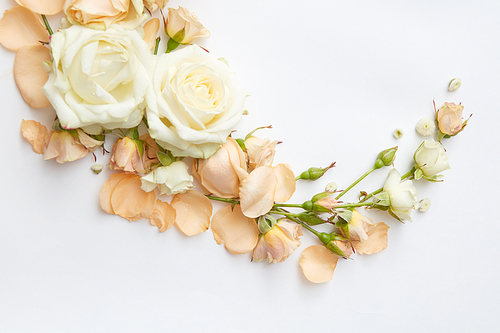 Vintage frame from different flowers on a white background, flat lay