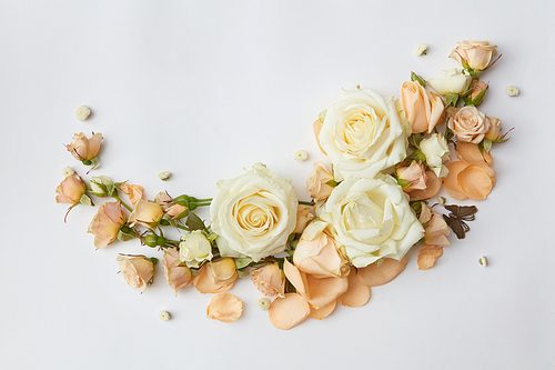 white roses and key on wedding invitations isolated on white
