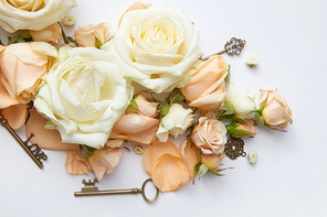 white roses with key on white background