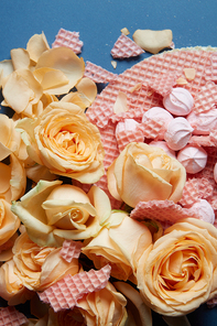 Beautiful bouquet of roses on a blue background