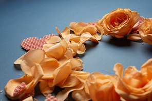 Round frame of flower petals with waffle heart close up