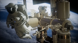 International Space Station and astronaut in outer space over the planet Earth. Elements of this image furnished by NASA.