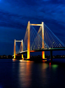 Evening shots of Benton Franklin intercounty bridge lit up over the Columbia River in Kennewick, Washington.