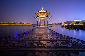 illuminated ancient Jixian Pavilion at West Lake, Hangzhou, China