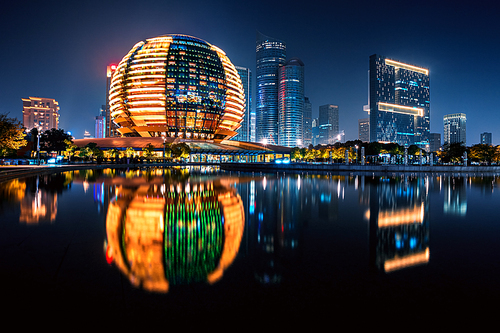 Night view of illuminated Qianjiang New Town with reflection, Hangzhou, Zhejiang, China