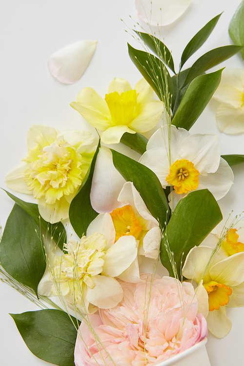 Wedding or Valentine's Day concept. Closeup of beautiful bouquet of white, yellow, pink flowers represented on white background.
