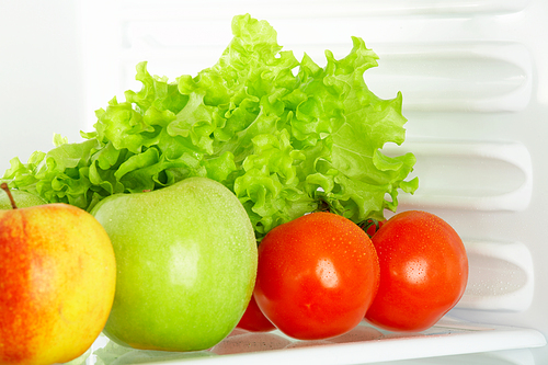Fresh vegetables and fruit in a refrigerator