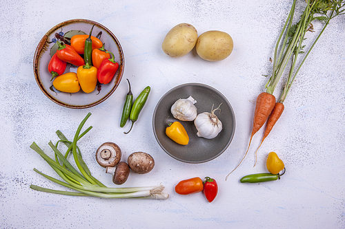 A colorful assortment of vegetables on a white background.