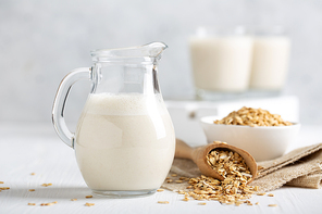 Oat milk. Healthy vegan non-dairy organic drink with flakes