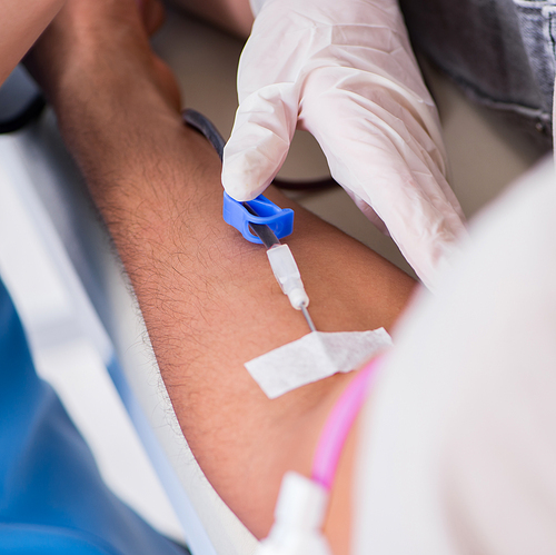 The patient getting blood transfusion in hospital clinic