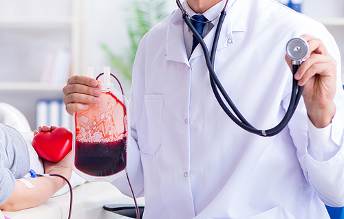 The patient getting blood transfusion in hospital clinic