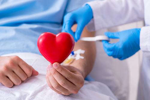 The male patient getting blood transfusion in hospital clinic