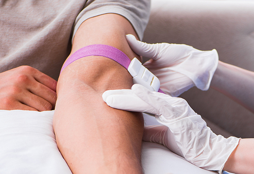 The patient getting blood transfusion in hospital clinic