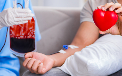 The patient getting blood transfusion in hospital clinic