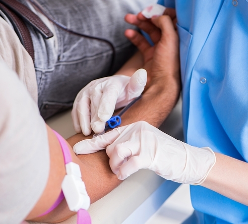 The patient getting blood transfusion in hospital clinic