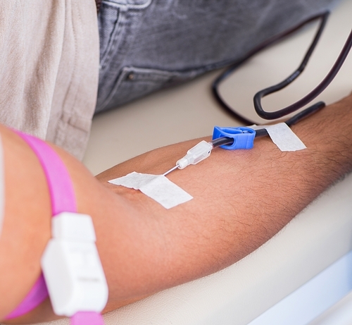 The patient getting blood transfusion in hospital clinic