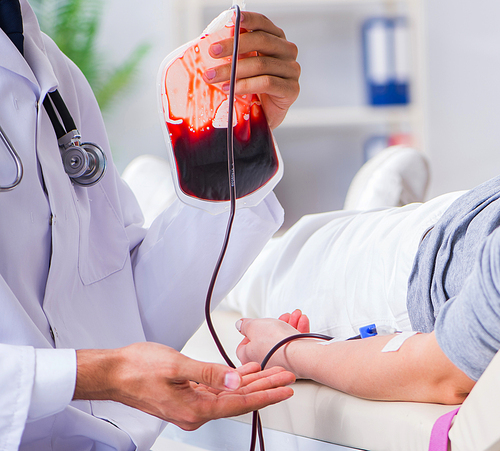 The patient getting blood transfusion in hospital clinic