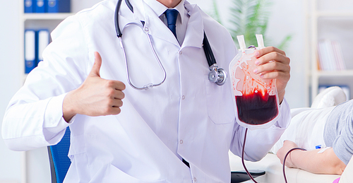 Patient getting blood transfusion in hospital clinic