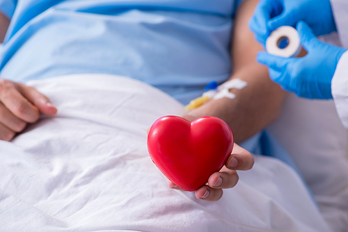 The male patient getting blood transfusion in hospital clinic