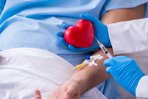 The male patient getting blood transfusion in hospital clinic