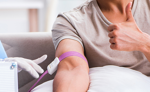 The patient getting blood transfusion in hospital clinic