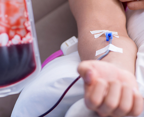 The patient getting blood transfusion in hospital clinic