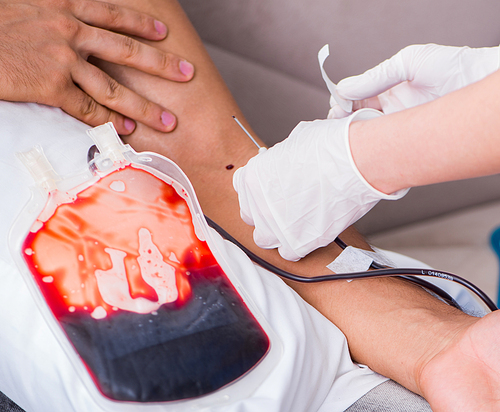 The patient getting blood transfusion in hospital clinic