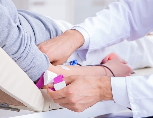 The patient getting blood transfusion in hospital clinic