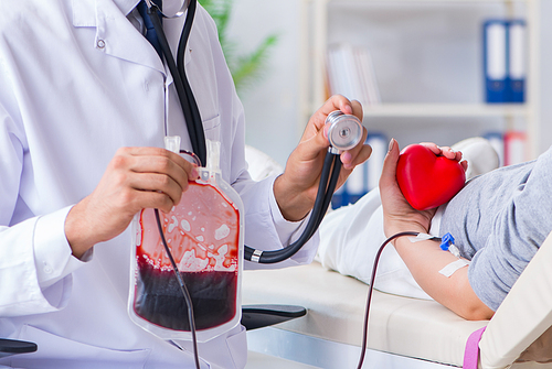 The patient getting blood transfusion in hospital clinic