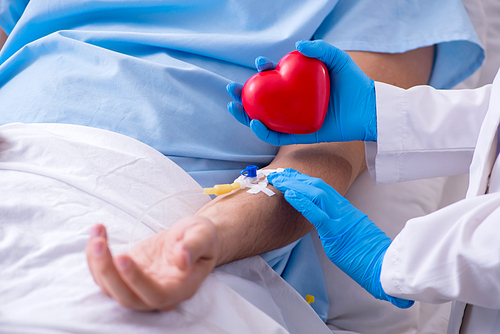 The male patient getting blood transfusion in hospital clinic