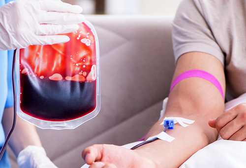 The patient getting blood transfusion in hospital clinic