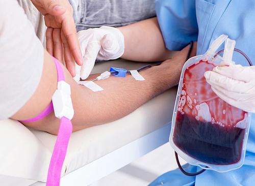 The patient getting blood transfusion in hospital clinic