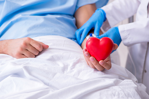 The male patient getting blood transfusion in hospital clinic