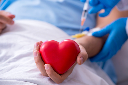 The male patient getting blood transfusion in hospital clinic