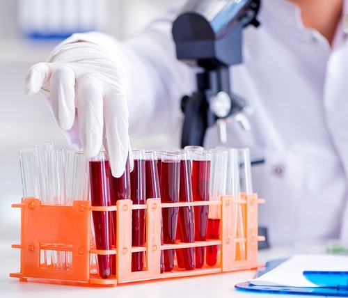 Female scientist researcher conducting an experiment in a laboratory