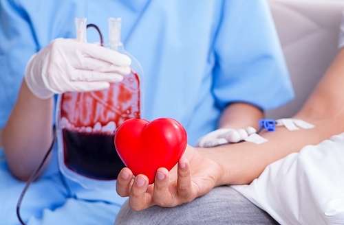 The patient getting blood transfusion in hospital clinic